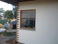 Přechod obkladu do omítky na rohu domu